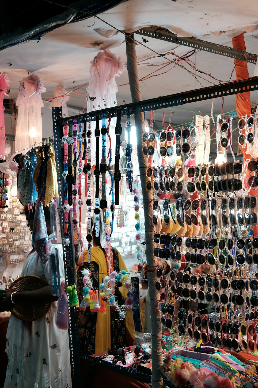 Stall selling sunglasses and accessories at night